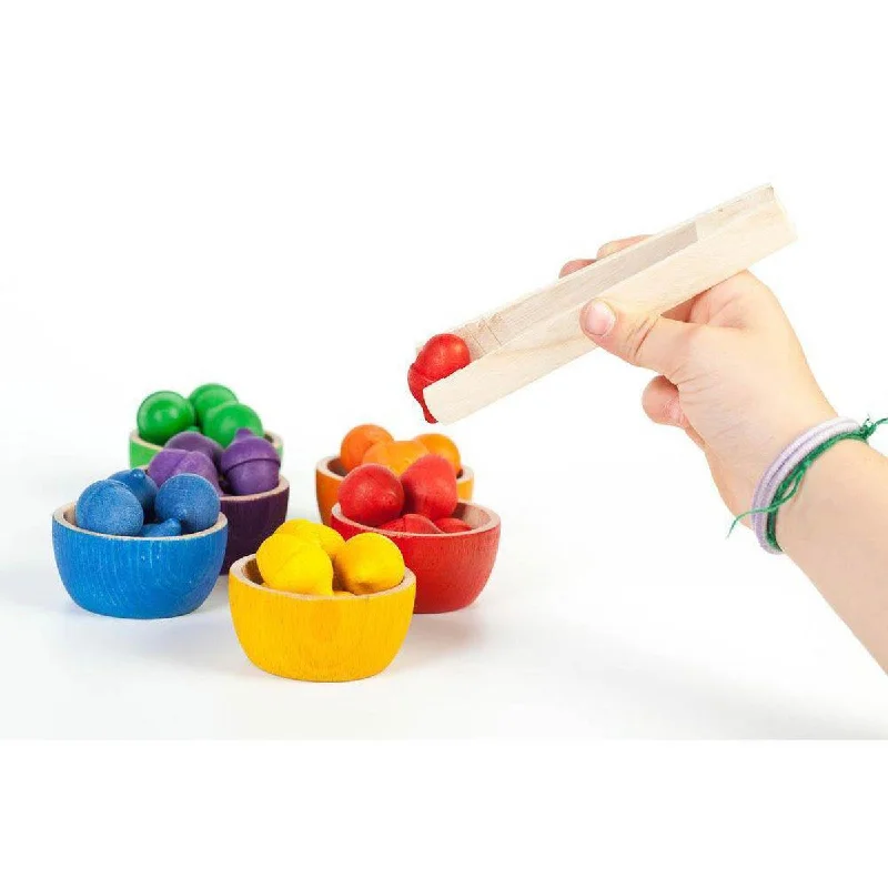 thoughtfully designed wooden toys              Grapat coloured bowls and acorns with tongs