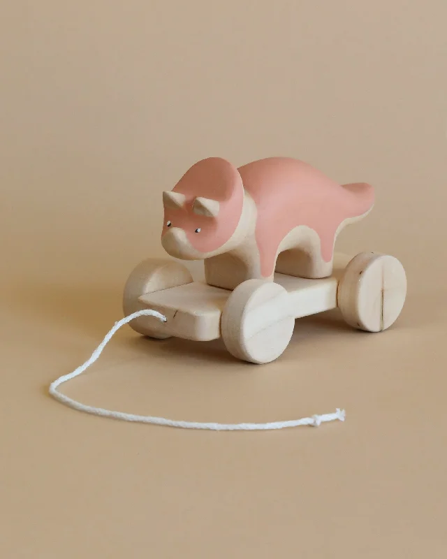 enchanting and whimsical wooden toys for children                   Handmade Wooden Triceratops Dinosaur Pull Toy With Built-In Magnets