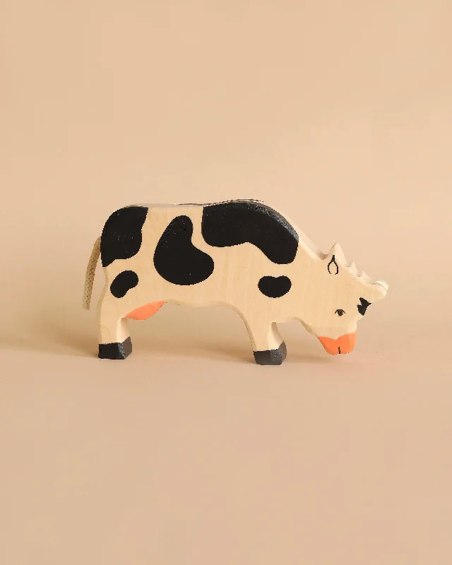 enchanting wooden toys that bring joy and happiness to children Holztiger Grazing Black Cow enchanting wooden toys that bring joy and happiness to children Holztiger Grazing Black Cow