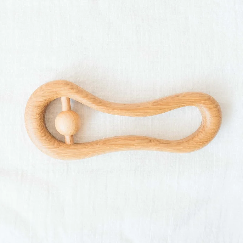 delightful wooden toys for children                   wooden oval rattle teether